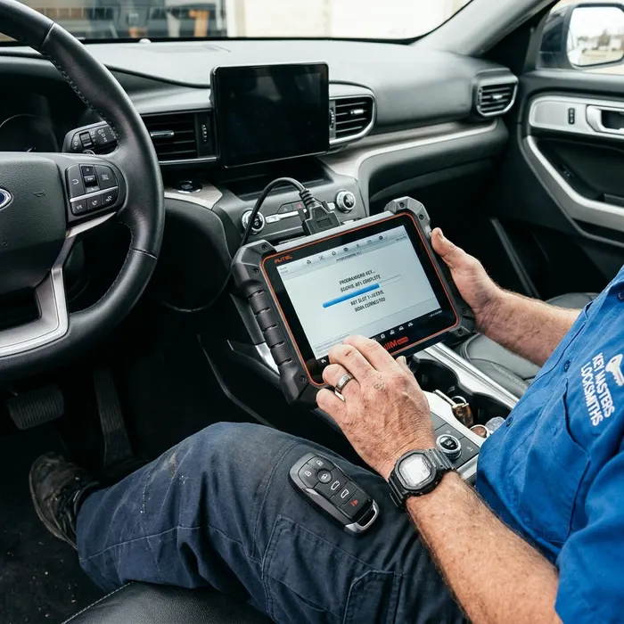 Automotive locksmith programming replacement smart key fob in Wake Forest