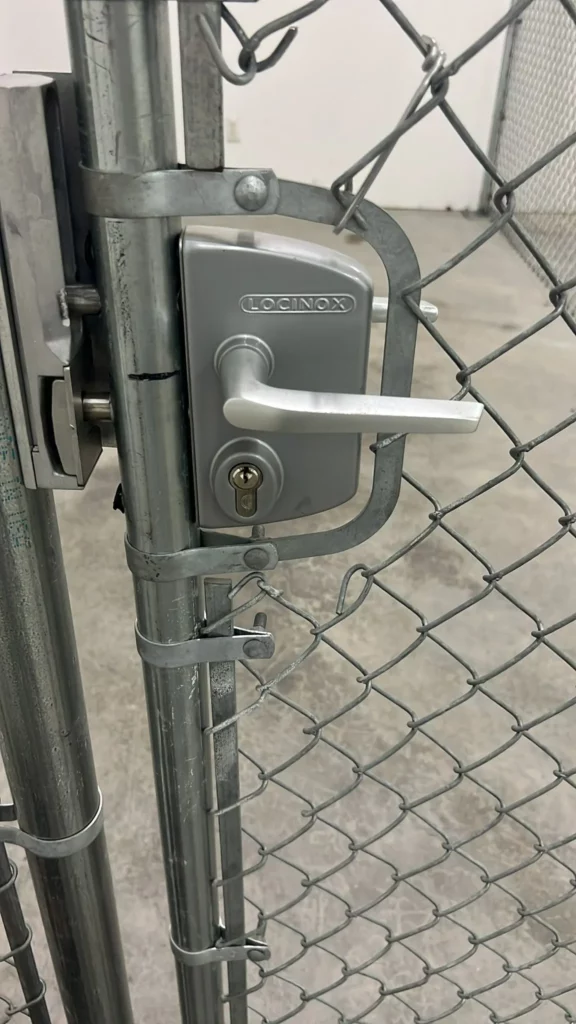 Locksmith Raleigh technician installing a new commercial lever handle lock on an office door in Raleigh North Carolina