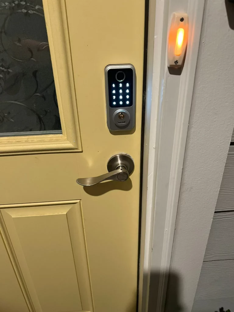 Locksmith Raleigh technician installing a commercial smart lock on an office door in Raleigh North Carolina