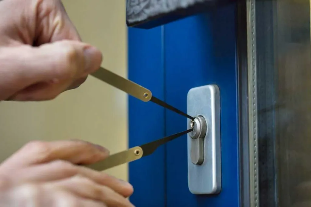 Locksmith Raleigh technician using non-destructive tools to unlock a residential door in Raleigh North Carolina